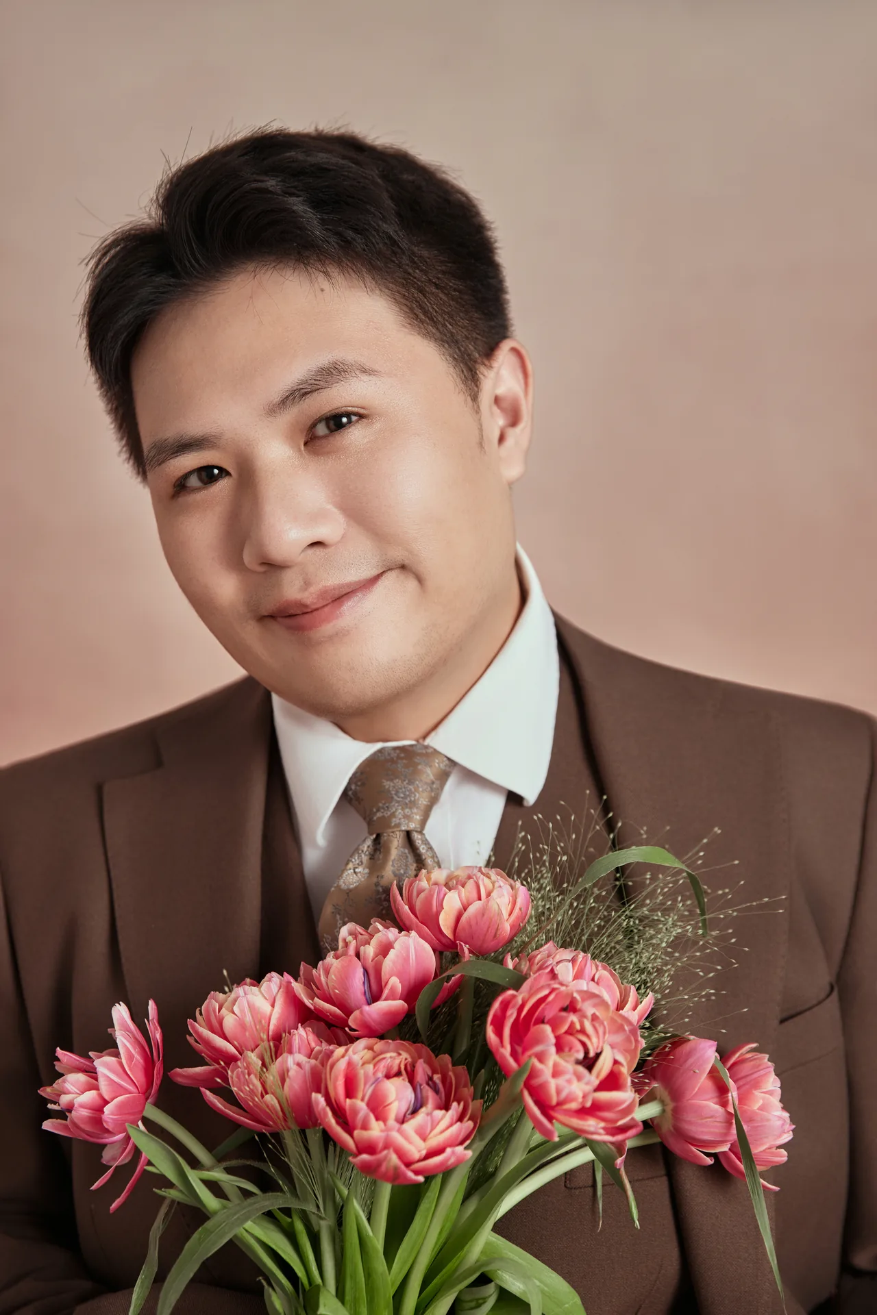 Groom portrait with flowers